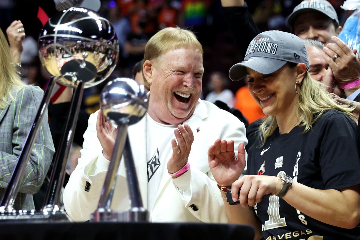 Las Vegas Aces head coach Becky Hammon (right, with Aces owner Mark Davis)
