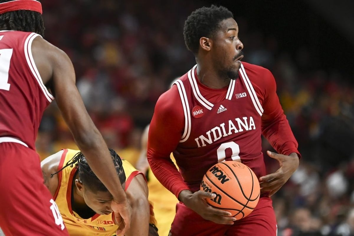 Mar 3, 2024; College Park, Maryland, USA;  Indiana Hoosiers guard Xavier Johnson (0) steals the ball from from Maryland Terrapins forward Julian Reese (10) during the second half at Xfinity Center.