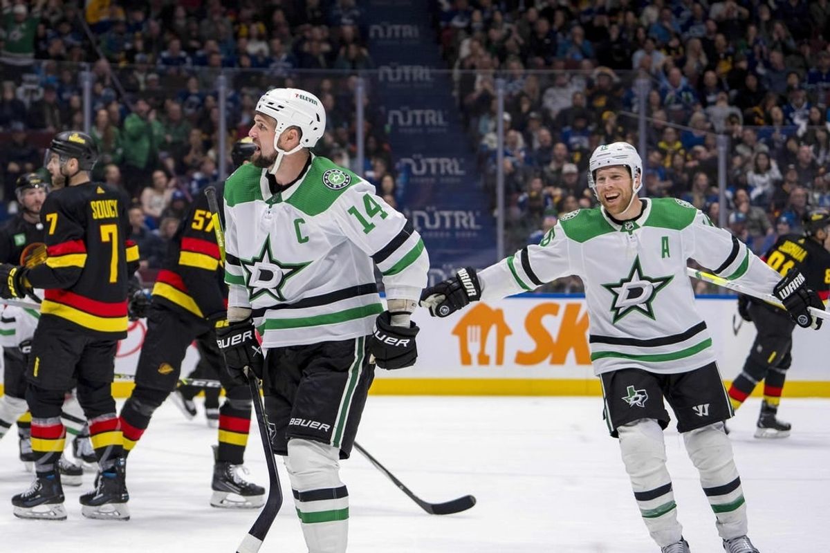 Mar 28, 2024; Vancouver, British Columbia, CAN; Dallas Stars forward Joe Pavelski (16) watches as forward Jamie Benn (14) celebrates his goal against the Vancouver Canucks in the third period at Rogers Arena. Dallas won 3 - 1.