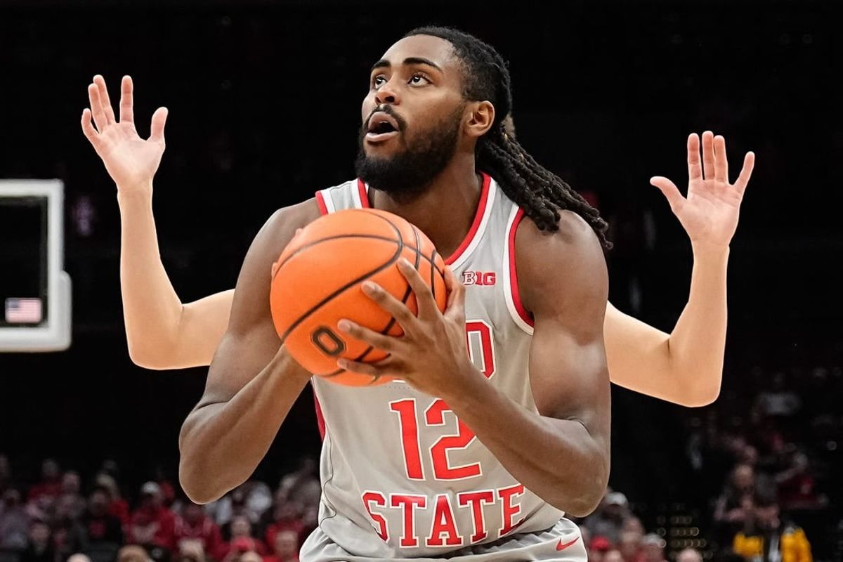Dec 6, 2023; Columbus, OH, USA; Ohio State Buckeyes guard Evan Mahaffey (12) picks up his dribble in front of a Miami Redhawks defender during the first half of the NCAA men   s basketball game at Value City Arena.