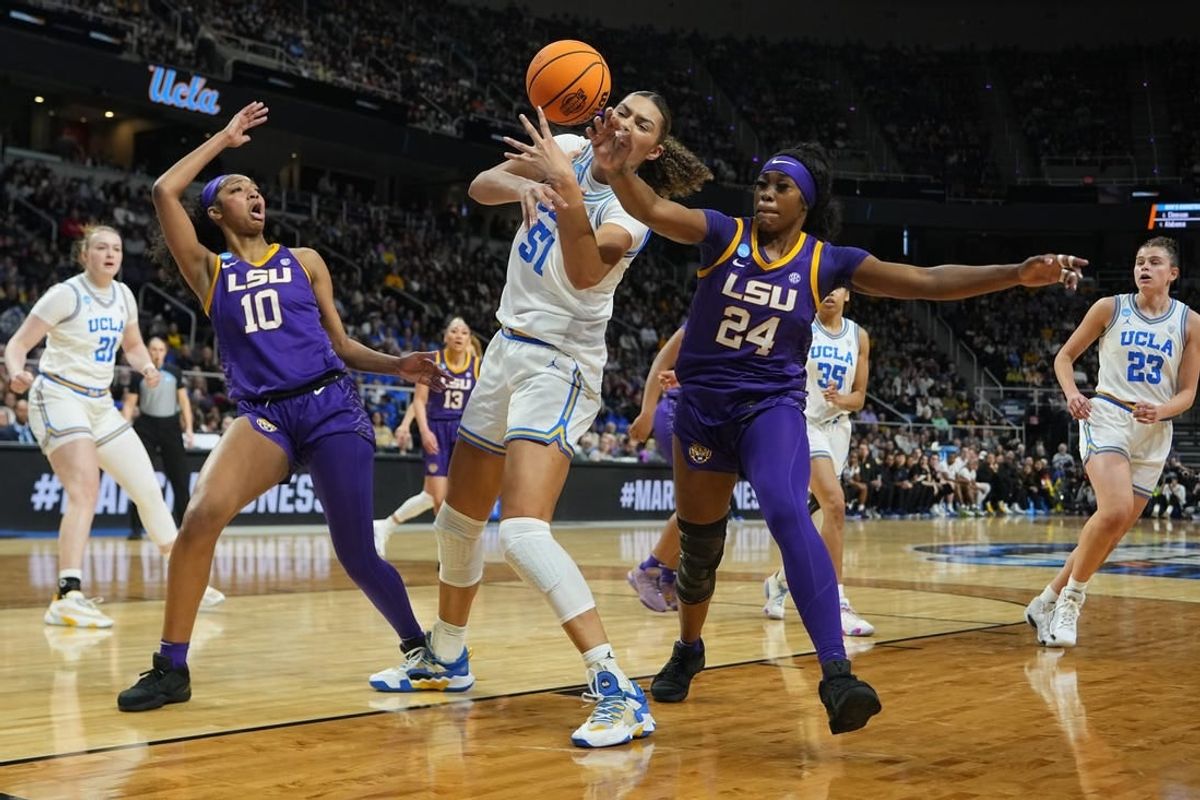 Mar 30, 2024; Albany, NY, USA; LSU Tigers guard Aneesah Morrow (24) knocks the ball away from UCLA Bruins forward Lauren Betts (51) during the first half in the semifinals of the Albany Regional of the 2024 NCAA Tournament at MVP Arena.
