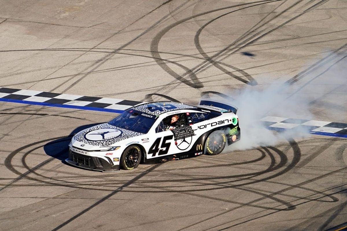 Apr 21, 2024; Talladega, Alabama, USA; NASCAR Cup Series driver Tyler Reddick (45) celebrates after winning the GEICO 500 at Talladega Superspeedway.