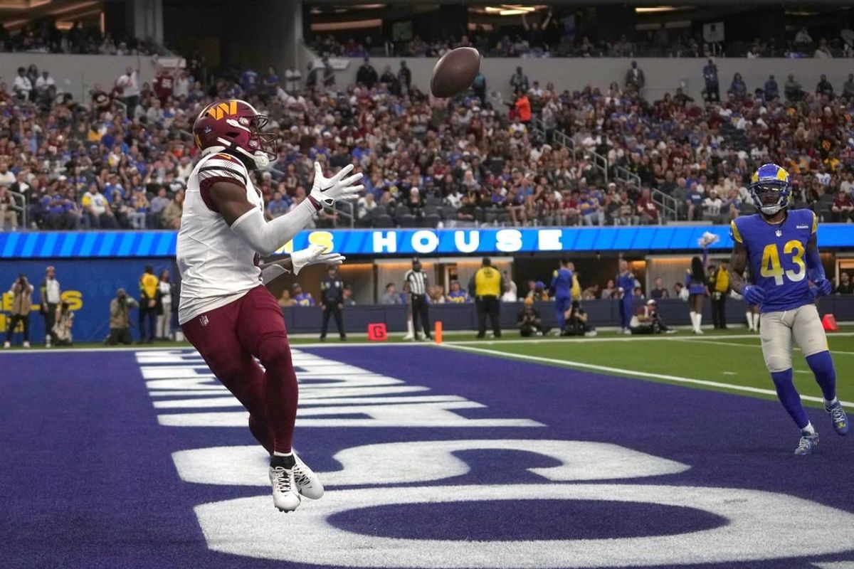 Dec 17, 2023; Inglewood, California, USA; Washington Commanders wide receiver Curtis Samuel (4) catches a touchdown pass in the second half against the Los Angeles Rams at SoFi Stadium.