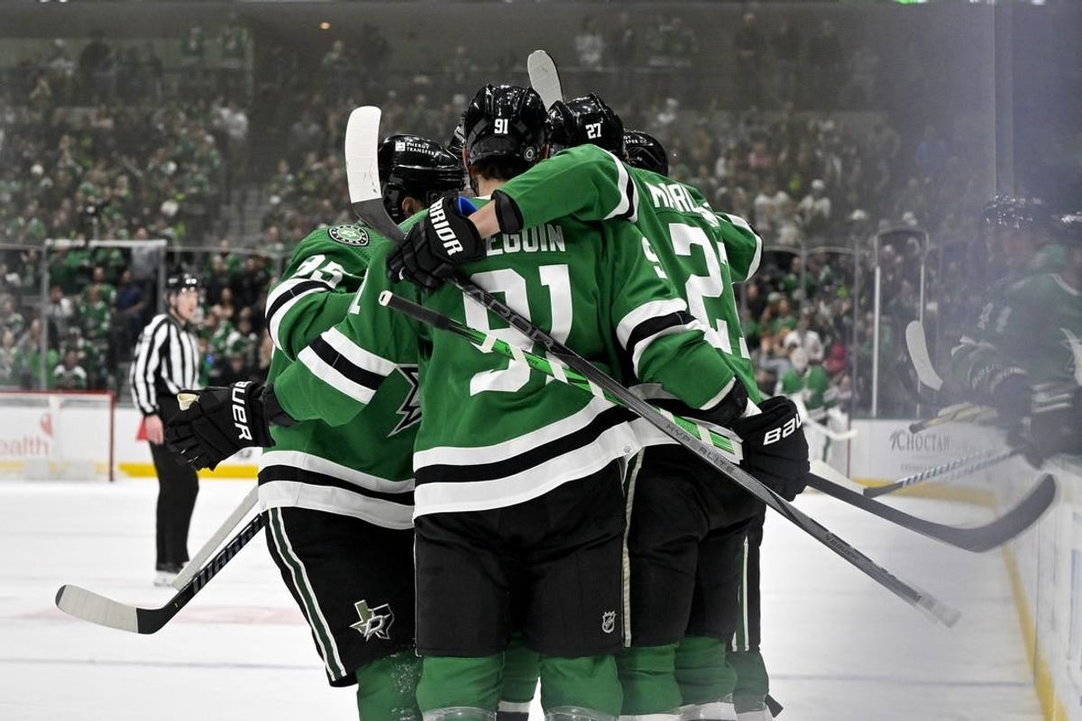 Feb 13, 2024; Dallas, Texas, USA; Dallas Stars center Matt Duchene (95) and center Tyler Seguin (91) \and left wing Mason Marchment (27) celebrates a goal scored by Marchment against the Carolina Hurricanes during the second period at the American Airlines Center.