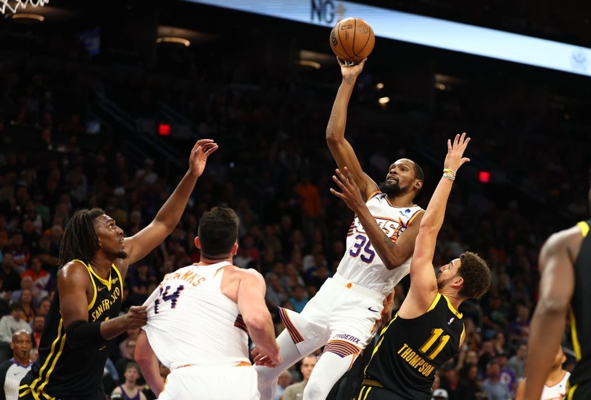 Nov 22, 2023; Phoenix, Arizona, USA; Phoenix Suns forward Kevin Durant (35) shoots the ball against the Golden State Warriors in the second half at Footprint Center.