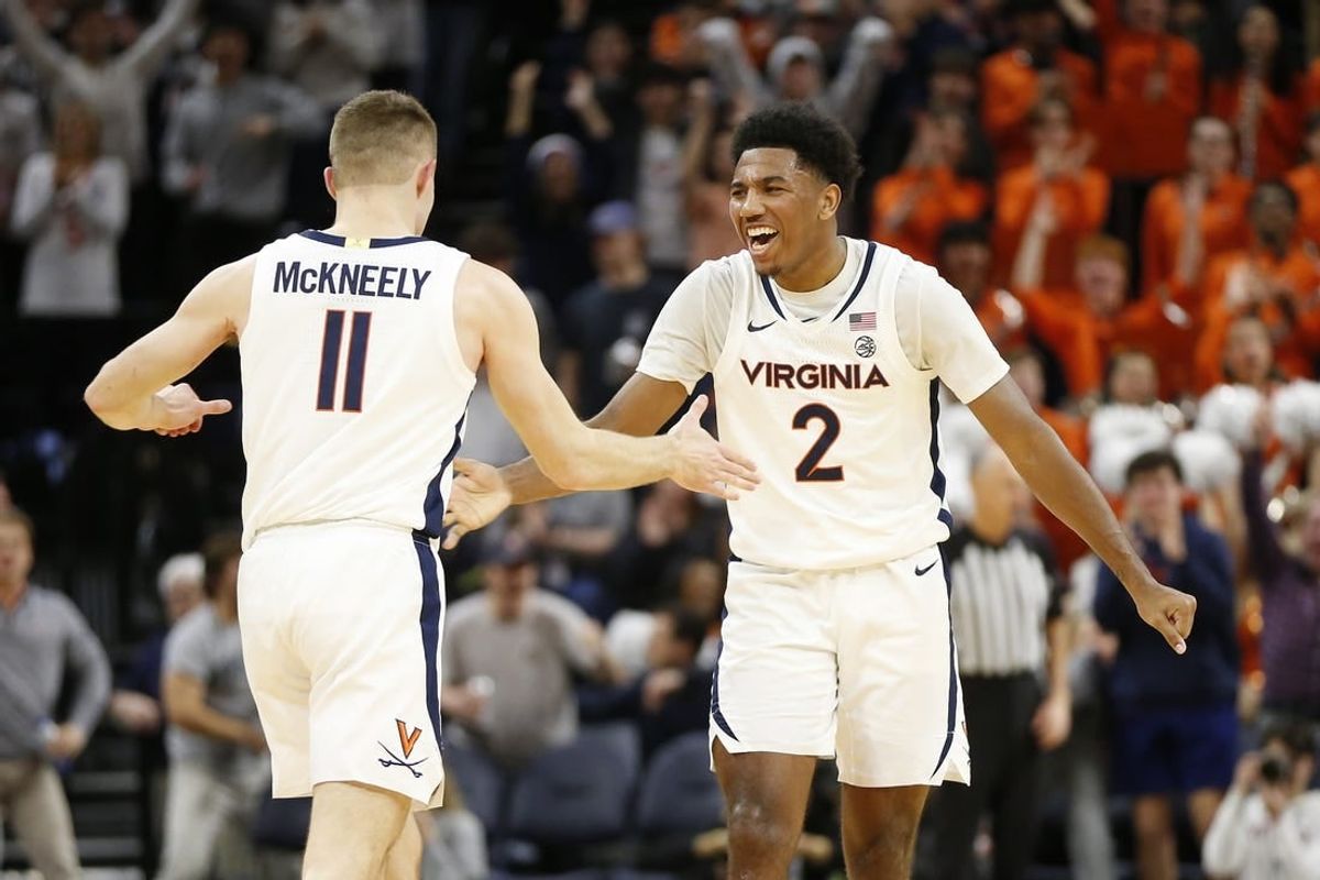 Jan 31, 2024; Charlottesville, Virginia, USA; Virginia Cavaliers guard Isaac McKneely (11) celebrates with Cavaliers guard Reece Beekman (2) after scoring against the Notre Dame Fighting Irish during the first half at John Paul Jones Arena.