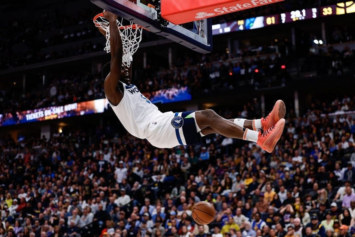May 6, 2024; Denver, Colorado, USA; Minnesota Timberwolves guard Anthony Edwards (5) dunks the ball in the second quarter against the Denver Nuggets during game two of the second round for the 2024 NBA playoffs at Ball Arena.