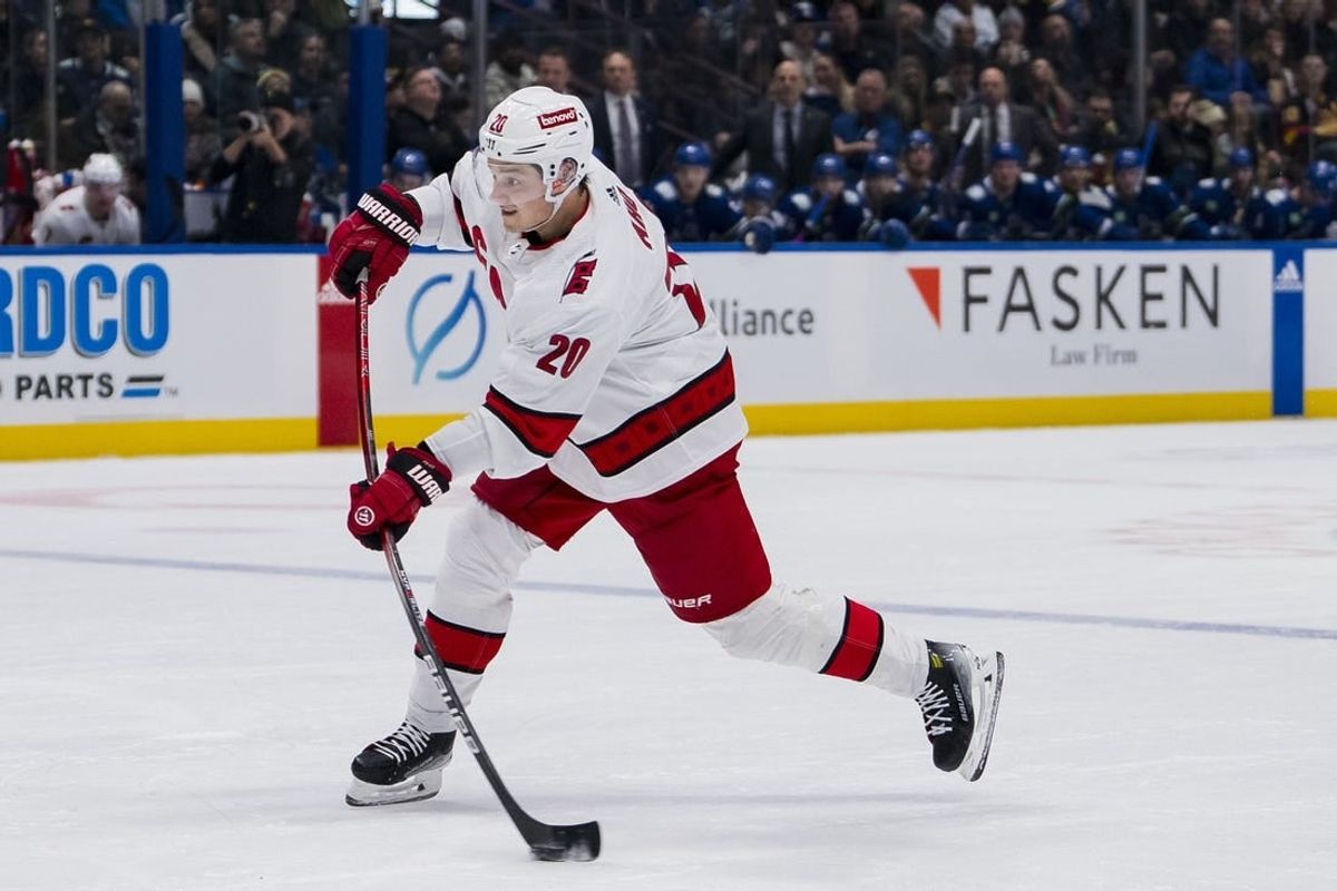 Dec 9, 2023; Vancouver, British Columbia, CAN; Carolina Hurricanes forward Sebastian Aho (20) shoots against the Vancouver Canucks in the second period at Rogers Arena.