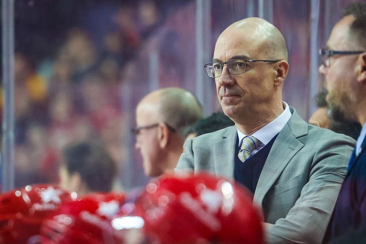 Mar 4, 2024; Calgary, Alberta, CAN; Calgary Flames head coach Ryan Huska on his bench against the Seattle Kraken during the second period at Scotiabank Saddledome.