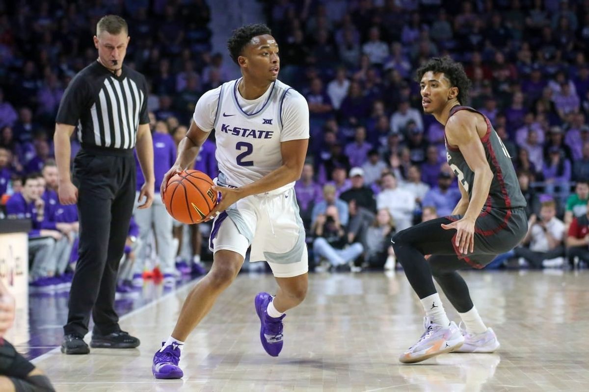 Jan 30, 2024; Manhattan, Kansas, USA; Kansas State Wildcats guard Tylor Perry (2) is guarded by Oklahoma Sooners guard Milos Uzan (12) during the first half at Bramlage Coliseum.
