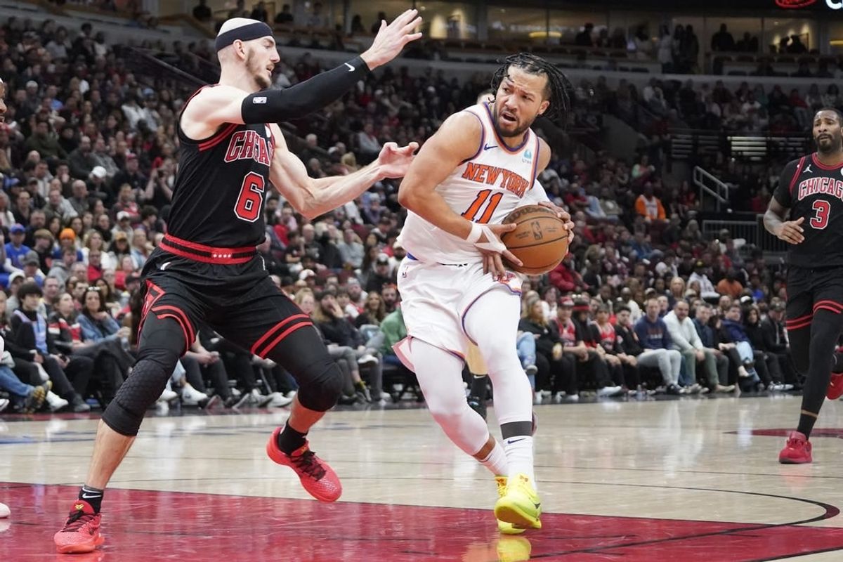 Apr 5, 2024; Chicago, Illinois, USA; Chicago Bulls guard Alex Caruso (6) defends New York Knicks guard Jalen Brunson (11) during the second half at United Center.