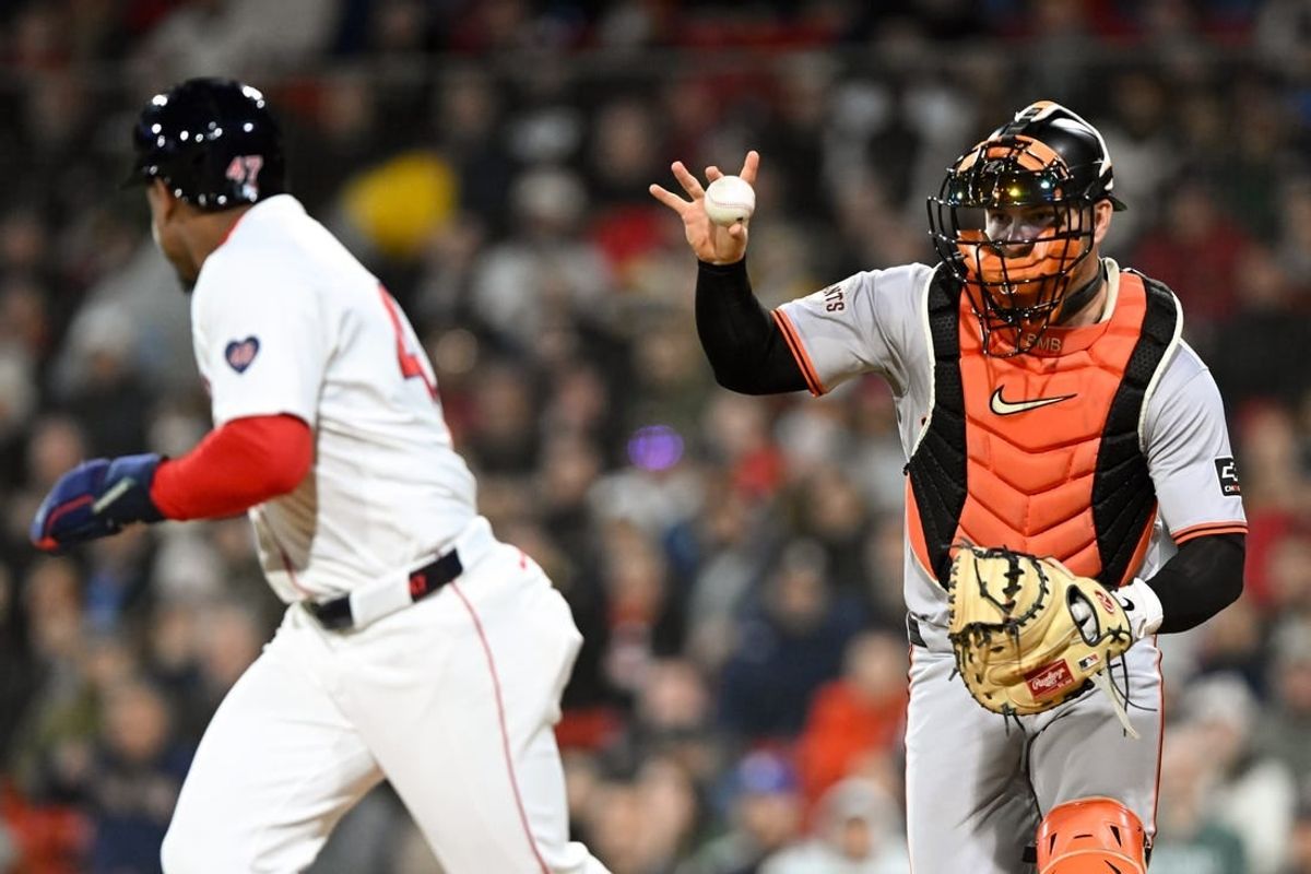 Apr 30, 2024; Boston, Massachusetts, USA; San Francisco Giants catcher Patrick Bailey (14) chases Boston Red Sox second baseman Enmanuel Valdez (47) for a tag during the fifth inning at Fenway Park.