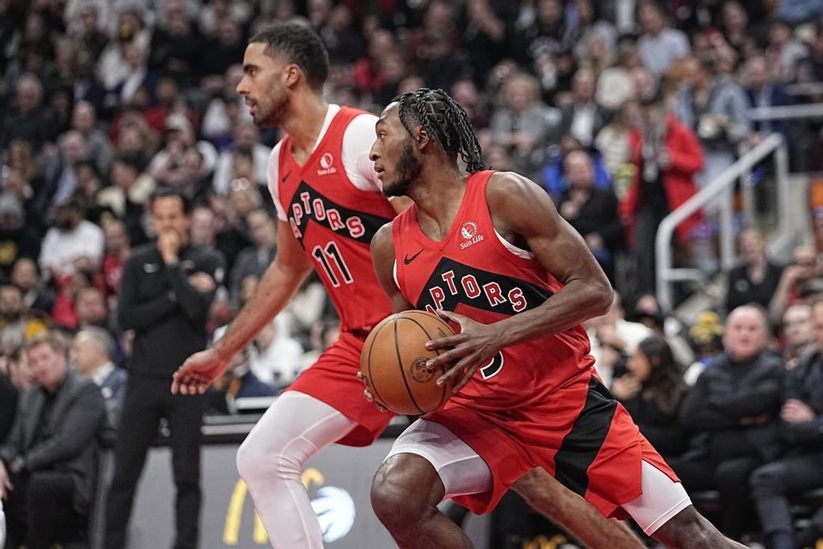 Jan 17, 2024; Toronto, Ontario, CAN; Toronto Raptors RJ Barrett (9)and  Toronto Raptors forward Jontay Porter (11) head up court against Miami Heat during the first half at Scotiabank Arena.