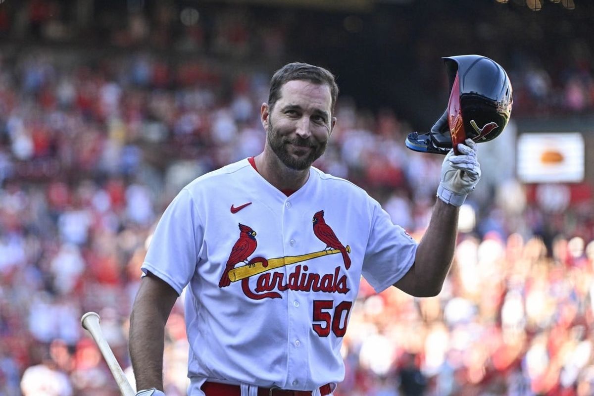 Oct 1, 2023; St. Louis, Missouri, USA;  St. Louis Cardinals pinch hitter Adam Wainwright (50) tips his cap as he receives a standing ovation after his final at bat during the eighth inning against the Cincinnati Reds at Busch Stadium.