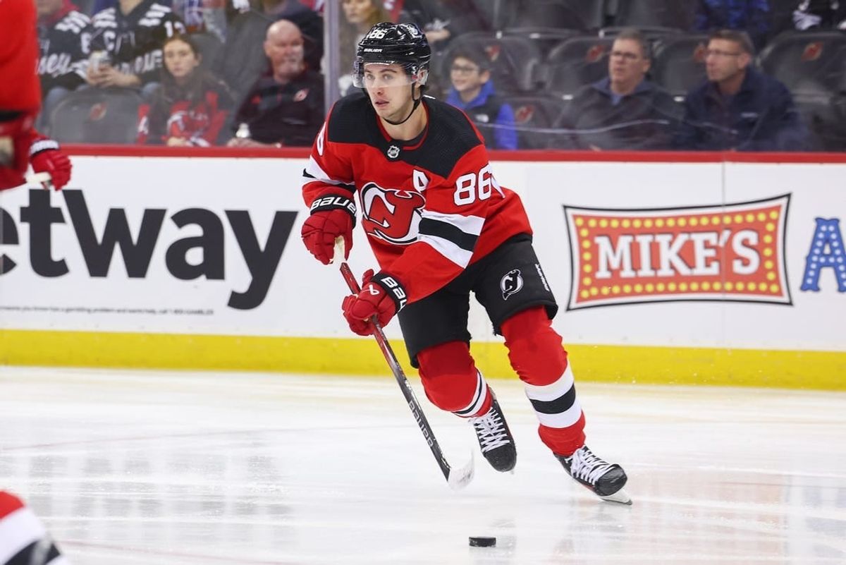 Nov 28, 2023; Newark, New Jersey, USA; New Jersey Devils center Jack Hughes (86) skates with the puck against the New York Islanders during the first period at Prudential Center.