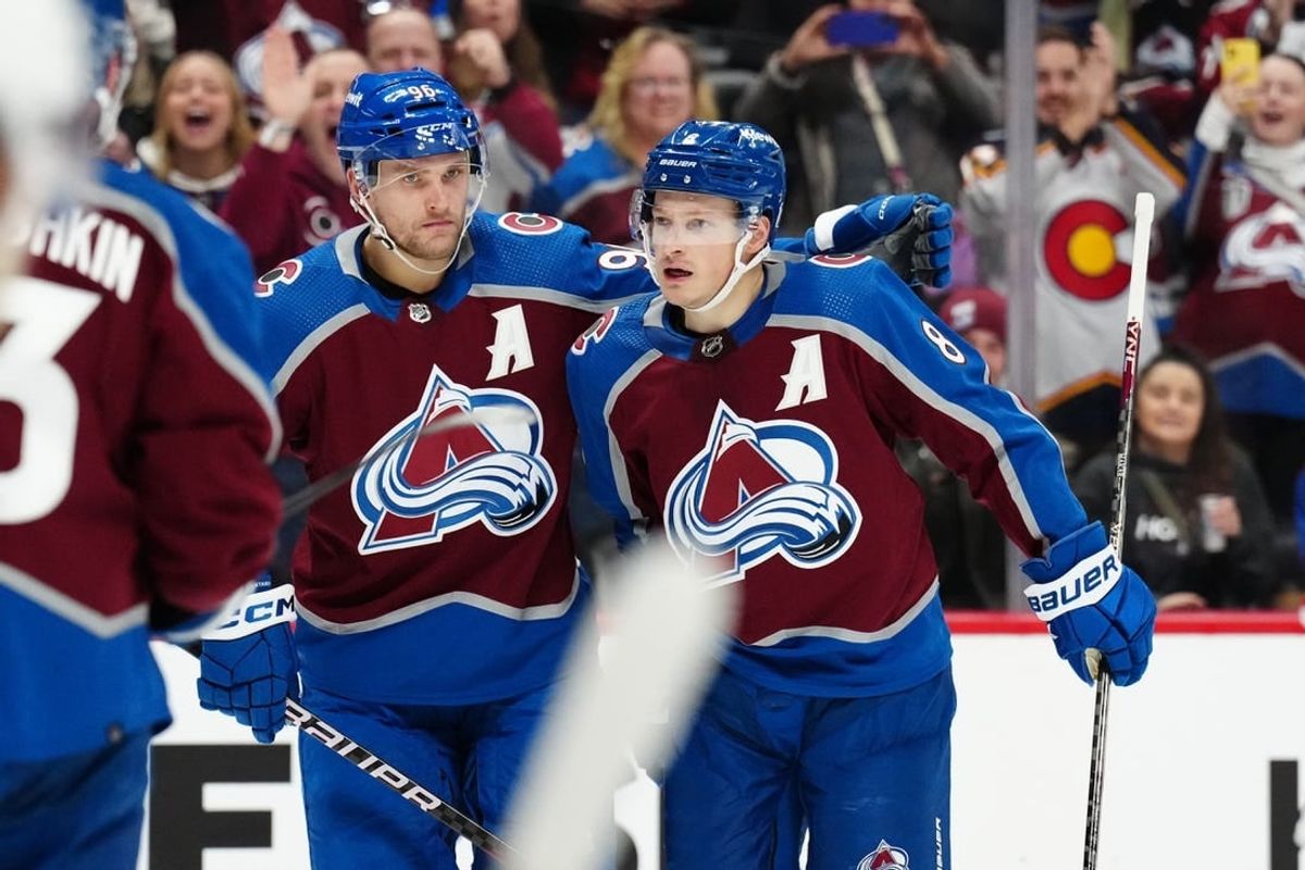 Dec 11, 2023; Denver, Colorado, USA; Colorado Avalanche defenseman Cale Makar (8) celebrates his goal with right wing Mikko Rantanen (96) in the second period against the Calgary Flames at Ball Arena.