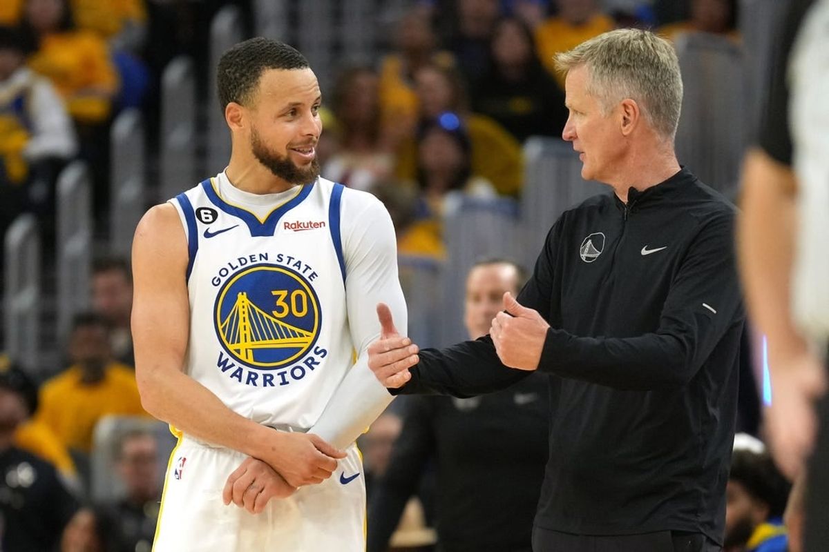 Apr 23, 2023; San Francisco, California, USA; Golden State Warriors guard Stephen Curry (30) talks with head coach Steve Kerr during the third quarter of game four of the 2023 NBA playoffs against the Sacramento Kings at Chase Center.