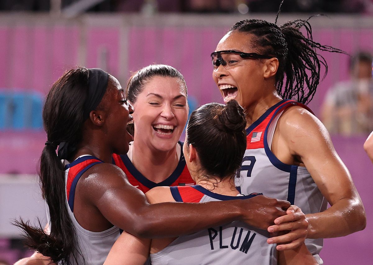 Jacquelyn Young, Stefanie Dolson, Kelsey Plum, and Allisha Gray celebrate winning the gold medal.