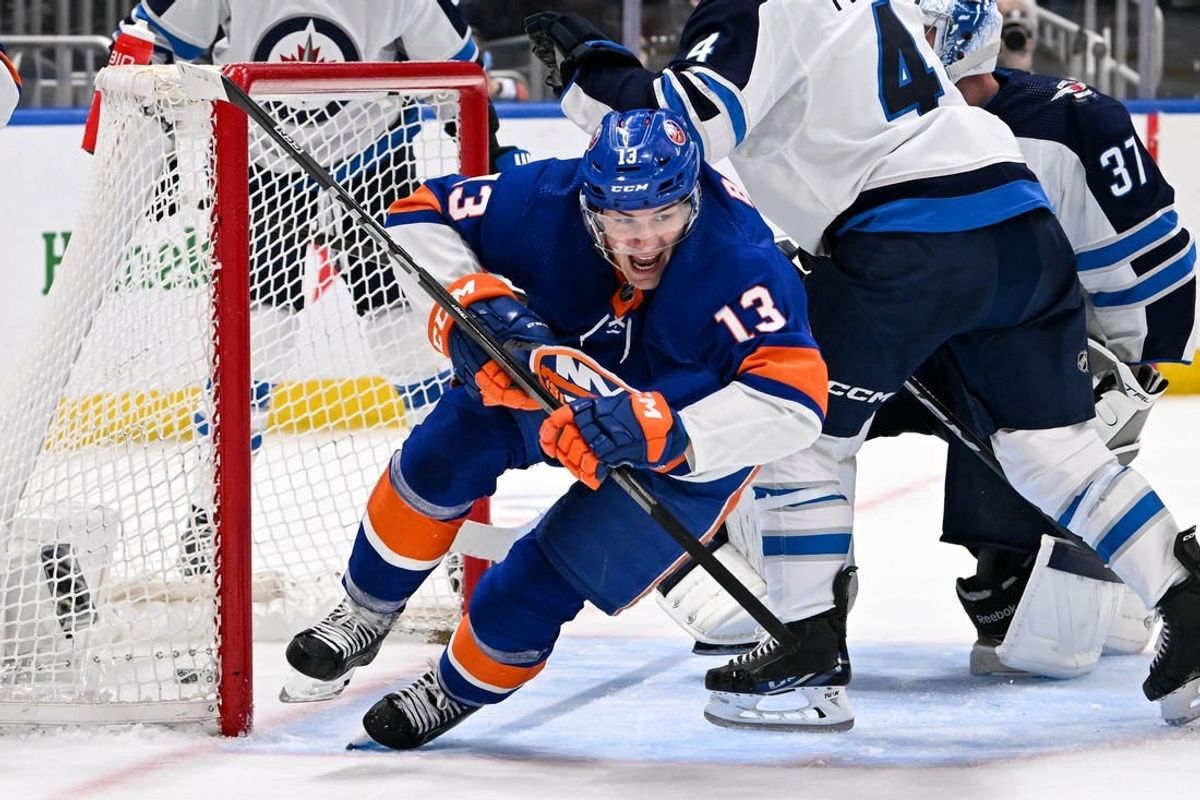 Mar 23, 2024; Elmont, New York, USA;  New York Islanders center Mathew Barzal (13) celebrates his goal against the Winnipeg Jets during the second period at UBS Arena.