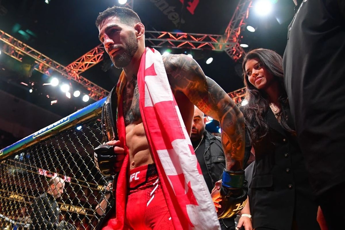 Feb 17, 2024; Anaheim, California, USA; Ilia Topuria celebrates his championship victory against Alexander Volkanovski during UFC 298 at Honda Center.