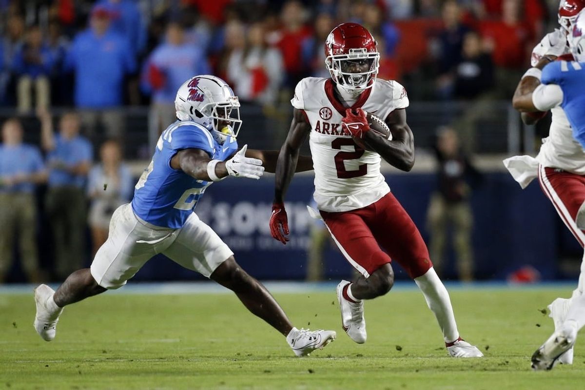 Oct 7, 2023; Oxford, Mississippi, USA; Arkansas Razorbacks wide receiver Andrew Armstrong (2) runs after a catch as Mississippi Rebels defensive back Trey Washington (25) makes the tackle during the first half at Vaught-Hemingway Stadium.