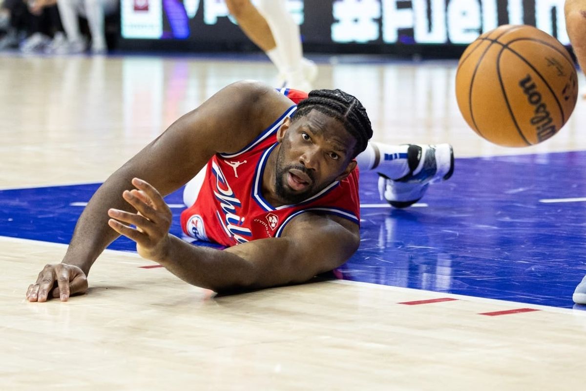 Apr 12, 2024; Philadelphia, Pennsylvania, USA; Philadelphia 76ers center Joel Embiid (21) watches a loose ball bounce away during the fourth quarter Orlando Magic at Wells Fargo Center.