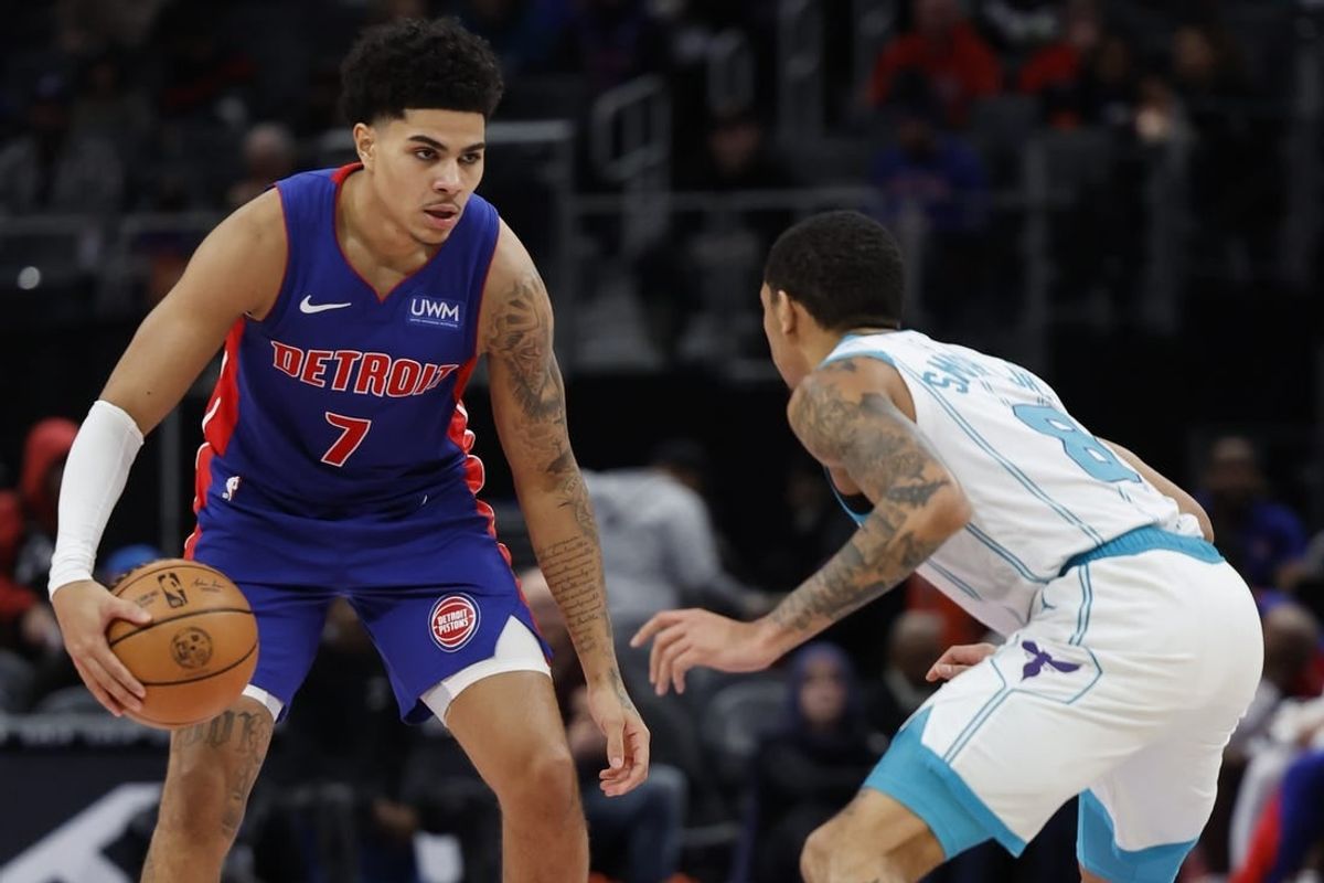 Jan 24, 2024; Detroit, Michigan, USA;  Detroit Pistons guard Killian Hayes (7) dribbles defended by Charlotte Hornets guard Nick Smith Jr. (8) in the first half at Little Caesars Arena.