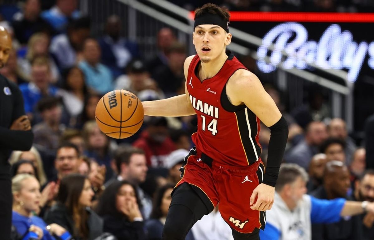 Dec 20, 2023; Orlando, Florida, USA; Miami Heat guard Tyler Herro (14) dribbles the ball against the Orlando Magic during the second quarter at KIA Center.