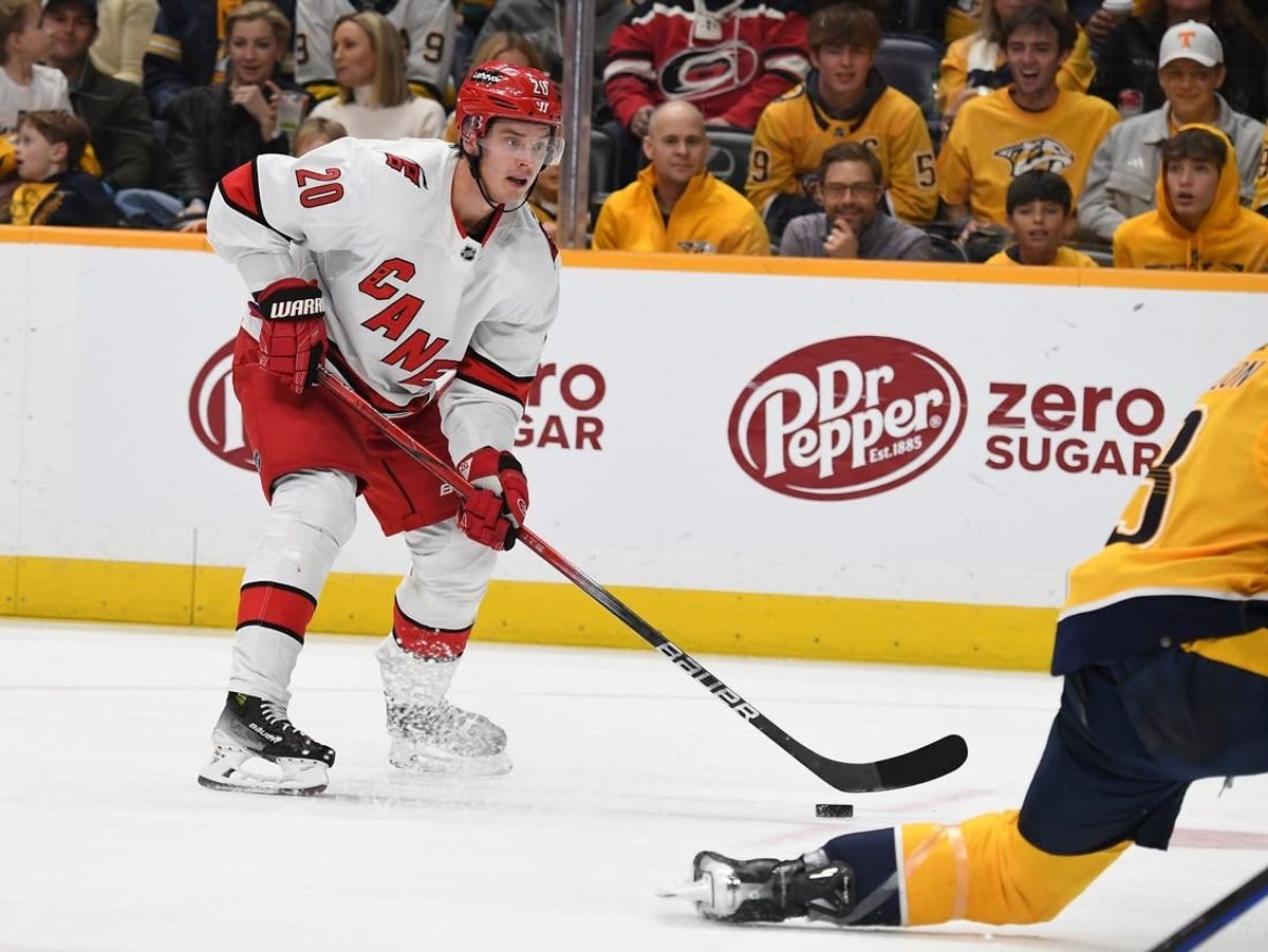Dec 27, 2023; Nashville, Tennessee, USA; Carolina Hurricanes center Sebastian Aho (20) skates with the puck during the second period against the Nashville Predators at Bridgestone Arena.