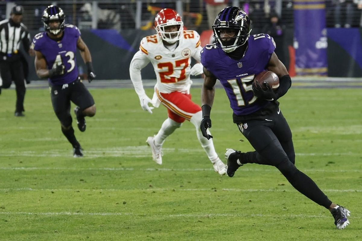 Jan 28, 2024; Baltimore, Maryland, USA; Baltimore Ravens wide receiver Nelson Agholor (15) runs with the ball against the Kansas City Chiefs in the AFC Championship football game at M&T Bank Stadium.