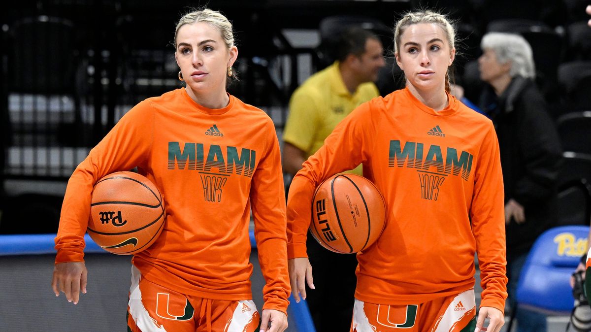 Haley Cavinder (L) and Hanna Cavinder (R) of the Miami Hurricanes warm up before the game against the Pittsburgh Panthers at Petersen Events Center on Jan.   1, 2023.