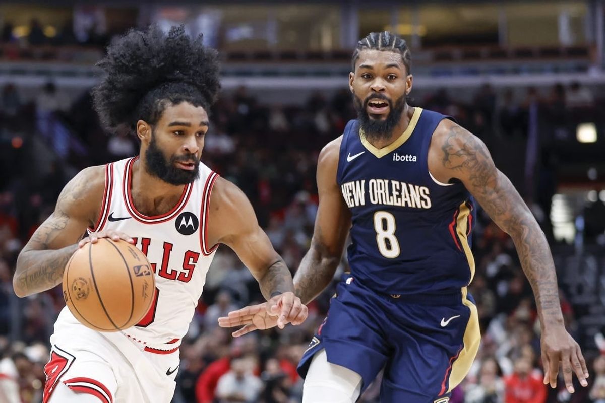 Dec 2, 2023; Chicago, Illinois, USA; Chicago Bulls guard Coby White (0) drives to the basket against New Orleans Pelicans forward Naji Marshall (8) during the second half at United Center.