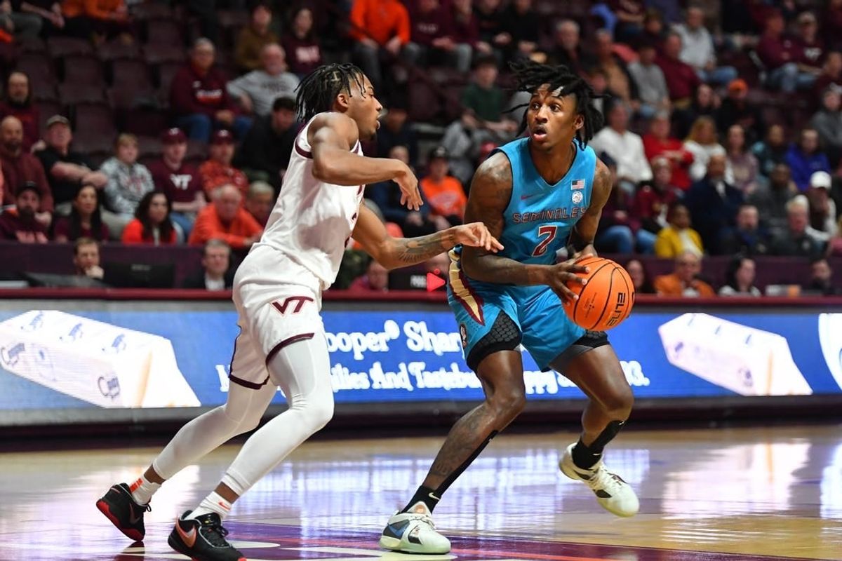 Feb 13, 2024; Blacksburg, Virginia, USA; Florida State Seminoles forward Jamir Watkins (2) looks to pass the ball while being defended by Virginia Tech Hokies guard MJ Collins (2)  at Cassell Coliseum.