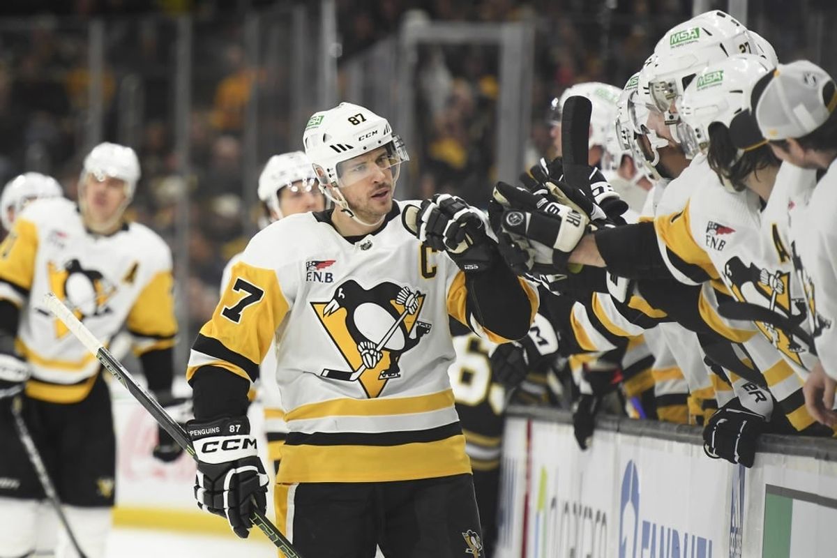 Jan 4, 2024; Boston, Massachusetts, USA; Pittsburgh Penguins center Sidney Crosby (87) celebrates his goal with his teammates during the third period against the Boston Bruins at TD Garden.