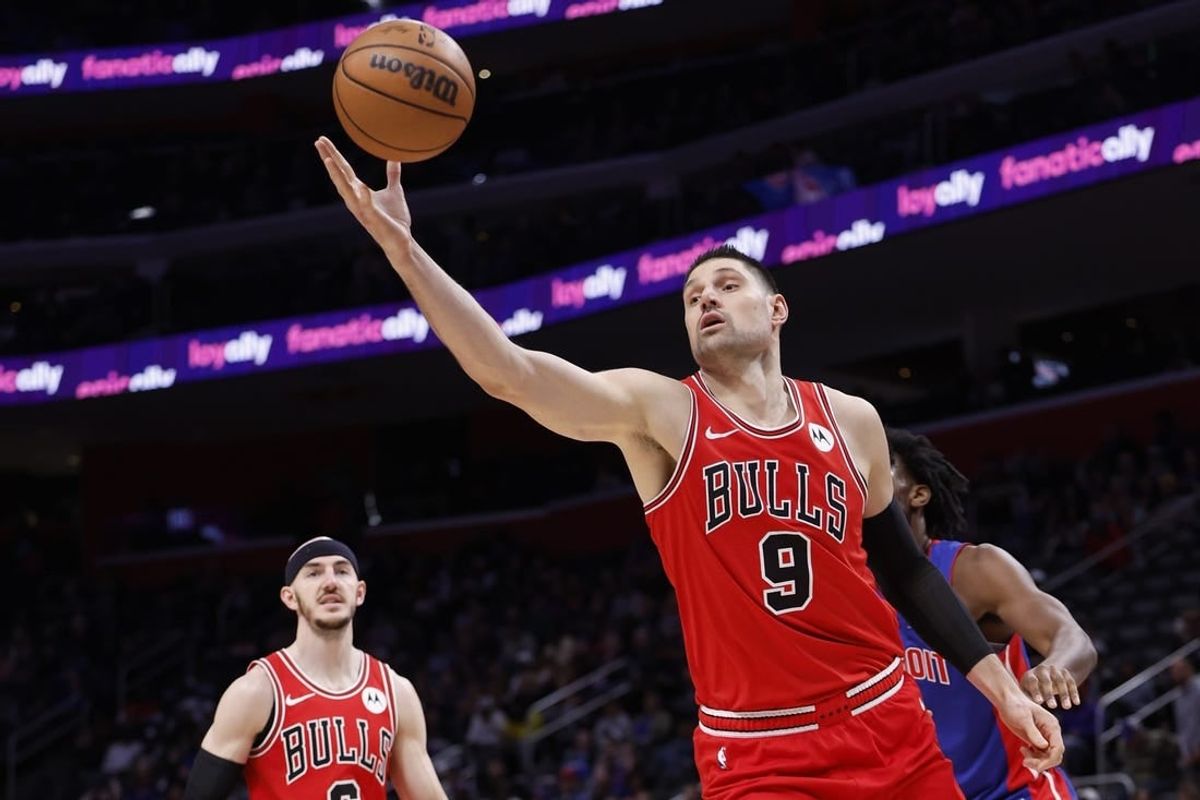 Apr 11, 2024; Detroit, Michigan, USA;  Chicago Bulls center Nikola Vucevic (9) grabs the rebound in the first half against the Detroit Pistons at Little Caesars Arena.
