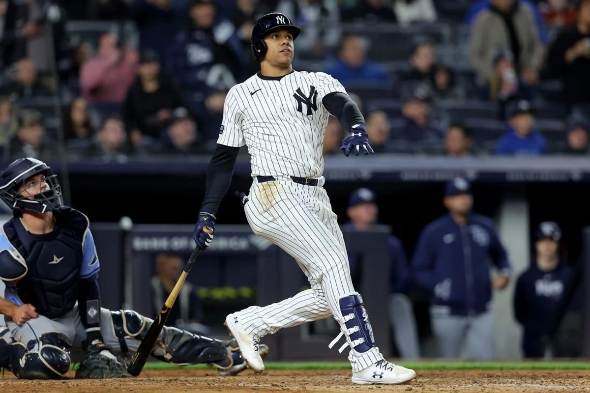 Apr 19, 2024; Bronx, New York, USA; New York Yankees right fielder Juan Soto (22) follows through on a three run home run against the Tampa Bay Rays during the seventh inning at Yankee Stadium.