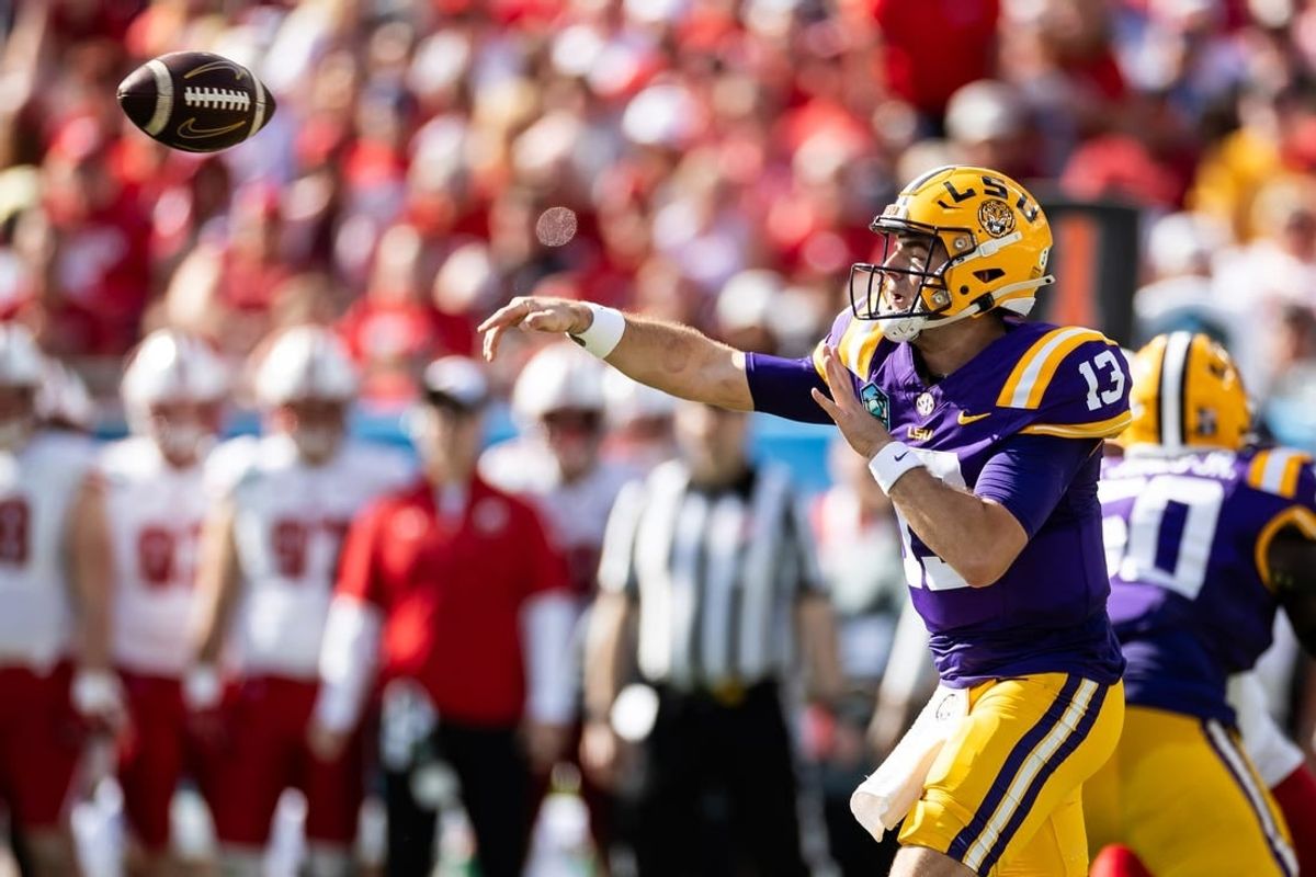 Jan 1, 2024; Tampa, FL, USA; LSU Tigers quarterback Garrett Nussmeier (13) throws the ball during the first half against the Wisconsin Badgers at Raymond James Stadium.