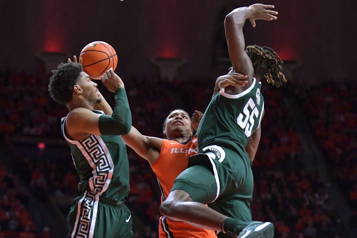 Jan 11, 2024; Champaign, Illinois, USA;  Illinois Fighting Illini guard Justin Harmon (4) drives to the basket during the first half against the Michigan State Spartans at State Farm Center.