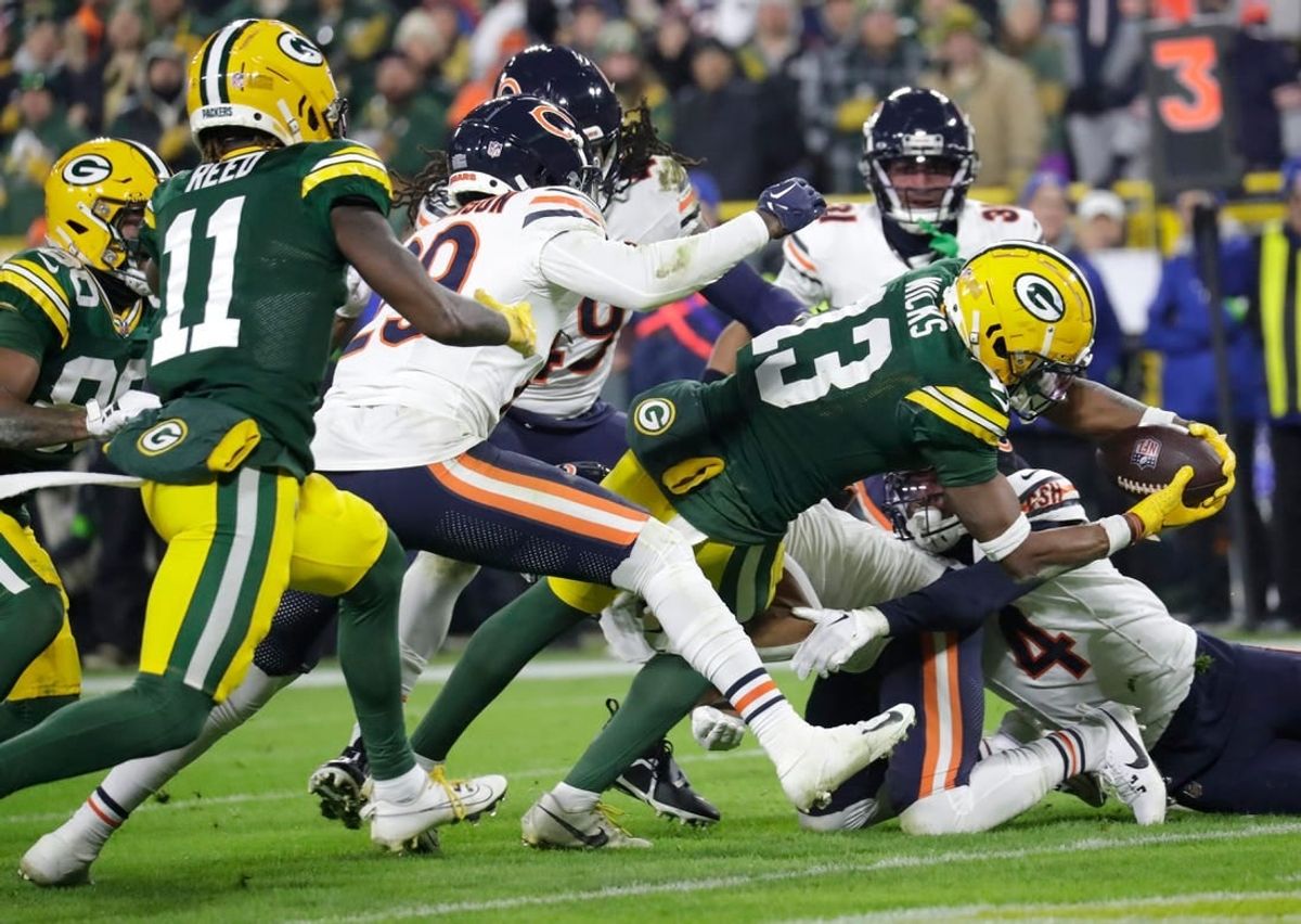 Green Bay Packers wide receiver Dontayvion Wicks (13) dives for a touchdown against the Chicago Bears in the third quarter during their football game Sunday, January 7, 2024, in Green Bay, Wisconsin. 
Dan Powers/USA TODAY NETWORK-Wisconsin.