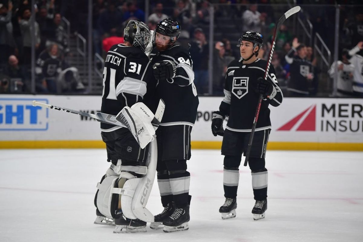 Mar 11, 2024; Los Angeles, California, USA; Los Angeles Kings goaltender David Rittich (31) defenseman Vladislav Gavrikov (84) and defenseman Jordan Spence (21) celebrate the victory against the New York Islanders at Crypto.com Arena.