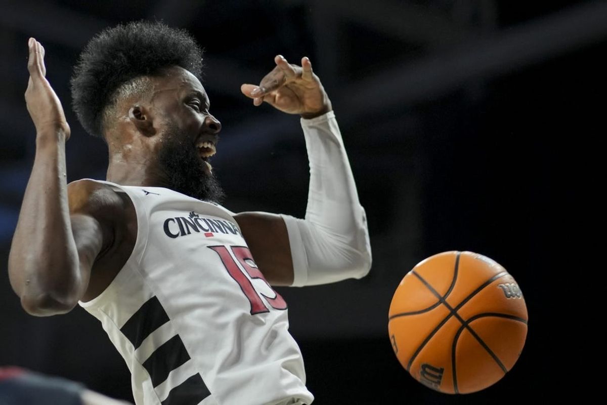 Nov 10, 2023; Cincinnati, Ohio, USA;  Cincinnati Bearcats forward John Newman III (15) reacts after dunking the ball against the Detroit Mercy Titans in the first half at Fifth Third Arena.