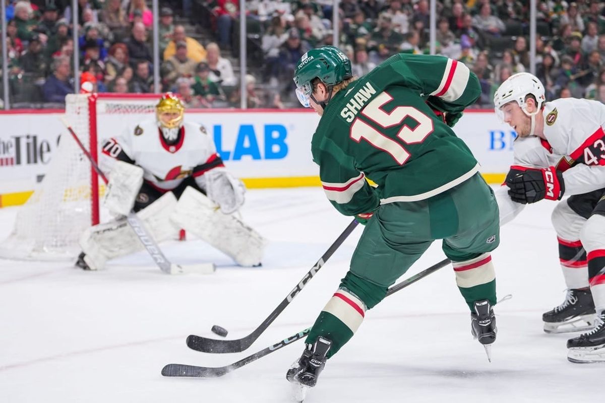 Apr 2, 2024; Saint Paul, Minnesota, USA; Minnesota Wild center Mason Shaw (15) shoots against the Ottawa Senators goaltender Joonas Korpisalo (70) in the second period at Xcel Energy Center.