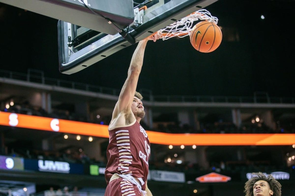 Nov 23, 2023; Kansas City, Missouri, USA; Boston College Eagles forward Quinten Post (12) dunks during the first half against the Loyola (Il) Ramblers at T-Mobile Center.