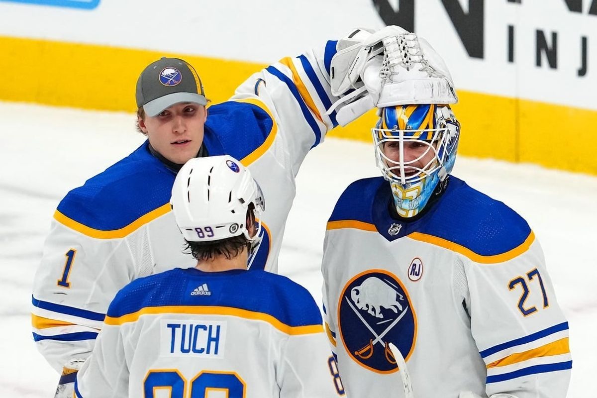 Dec 15, 2023; Las Vegas, Nevada, USA; Buffalo Sabres goaltender Devon Levi (27) celebrates with Buffalo Sabres goaltender Ukko-Pekka Luukkonen (1) and Buffalo Sabres right wing Alex Tuch (89) after the Sabres defeated the Vegas Golden Knights 5-2 at T-Mobile Arena.