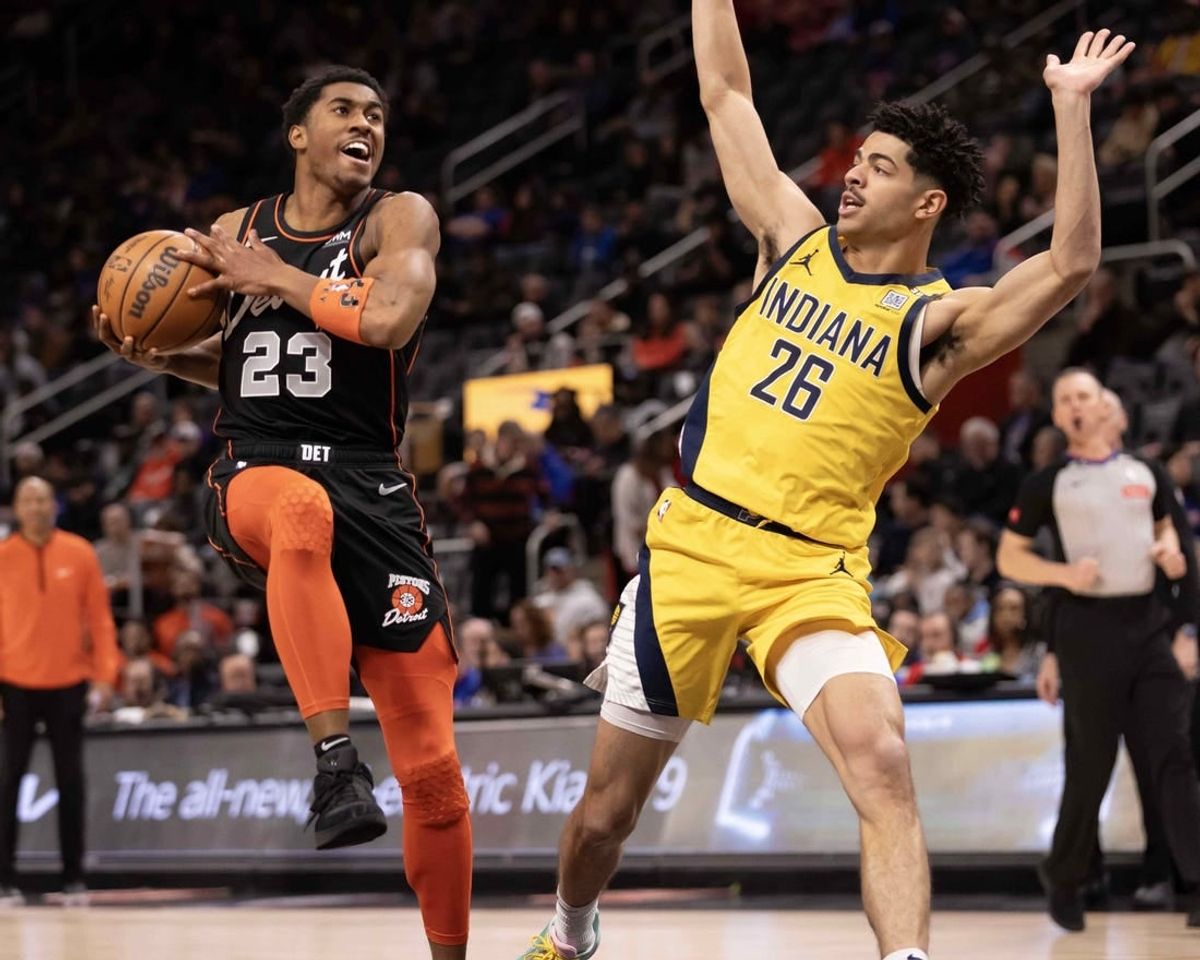 Mar 20, 2024; Detroit, Michigan, USA; Detroit Pistons guard Jaden Ivey (23) drives to the basket next to Indiana Pacers guard Ben Sheppard (26) in the first half at Little Caesars Arena.