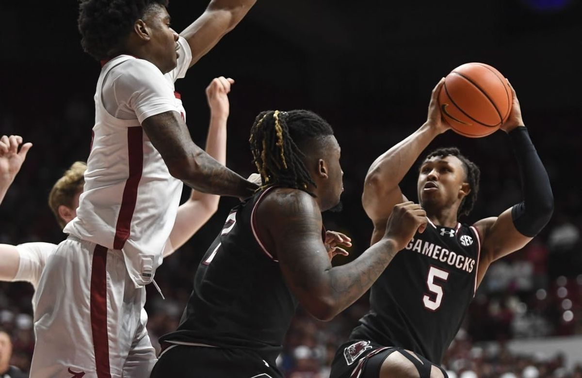 Jan 9, 2024; Tuscaloosa, Alabama, USA; South Carolina guard Meechie Johnson (5) shoots the ball defended by Alabama forward Nick Pringle (23) during the game Coleman Coliseum.