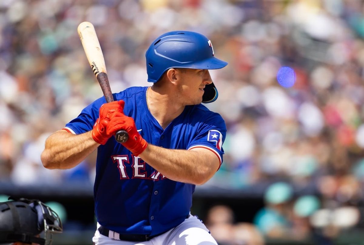 Mar 18, 2024; Surprise, Arizona, USA; Texas Rangers outfielder Wyatt Langford against the Seattle Mariners during a spring training baseball game at Surprise Stadium.