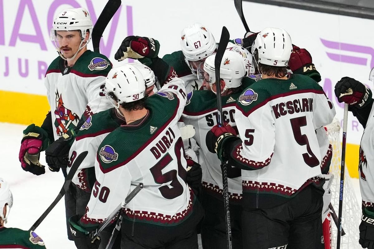 Nov 25, 2023; Las Vegas, Nevada, USA; Arizona Coyotes players celebrate after defeating the Vegas Golden Knights at T-Mobile Arena.