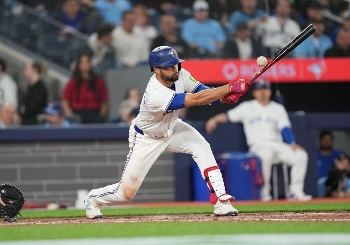 Apr 9, 2024; Toronto, Ontario, CAN; Toronto Blue Jays third baseman Isiah Kiner-Falefa (7) hits a single against the Seattle Mariners during the sixth inning at Rogers Centre.