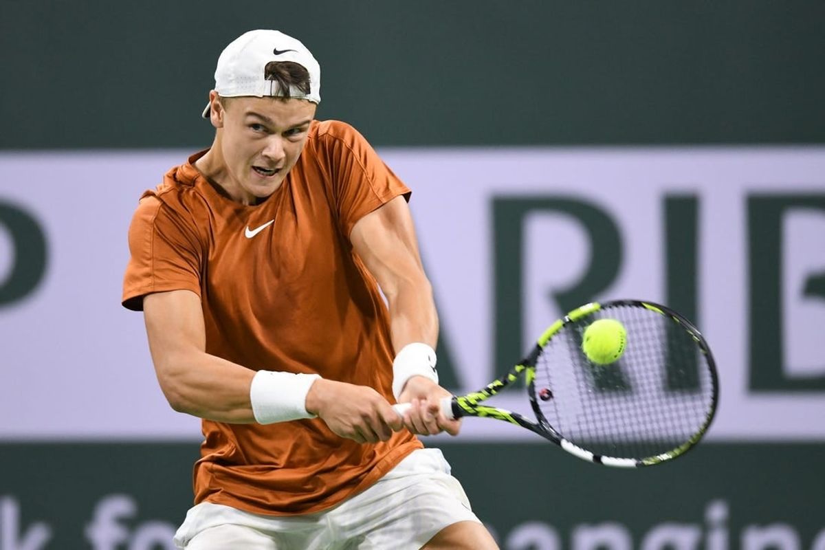 Mar 11, 2023; Indian Wells, CA, USA; Holger Rune (DEN) hits a backhand during his second round match against Mackenzie McDonald (USA) during the BNP Paribas Open at Indian Wells Tennis Garden.